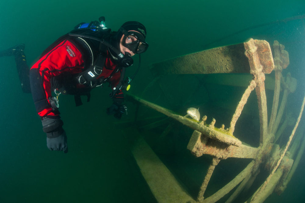 Bill Streever dives near a paddle wheel in Canada. (Photo courtesy of Little, Brown and Company).