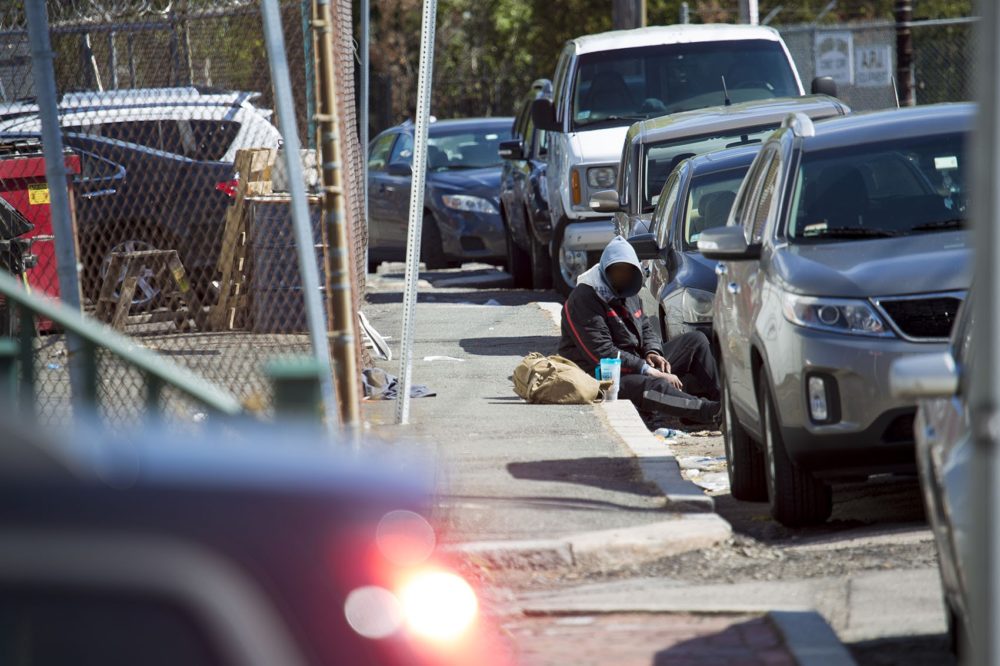 On “Methadone Mile,” a one-mile stretch of Massachusetts Avenue in Boston, it is not uncommon to witness people using drugs. Here, we’ve digitally blurred this person’s face to prevent identification. (Jesse Costa/WBUR)