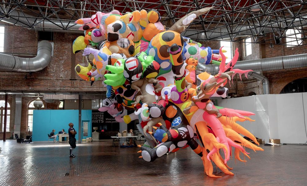 Nick Cave looks at his sculpture at the BCA for his project &quot;Augment,&quot; commissioned by Boston's Now + There. (Robin Lubbock/WBUR)