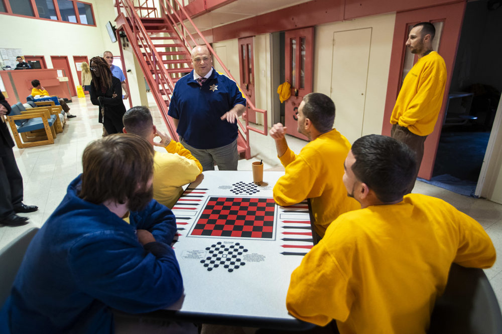 Sheriff Nick Cocchi speaks with a group of men from the addiction treatment unit at the Hampden County Jail in Ludlow last December. (Jesse Costa/WBUR)