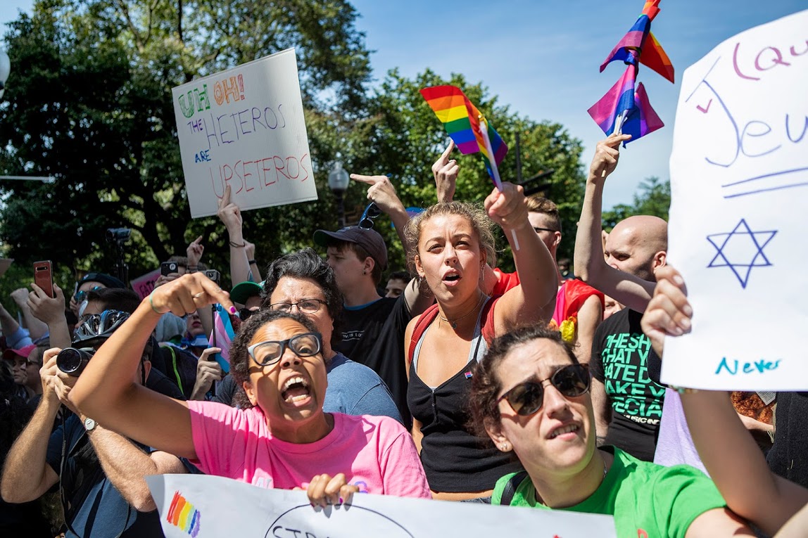 Counter-protesters scream at parade participants as the pass by the Boston Common. (Jesse Costa/WBUR)