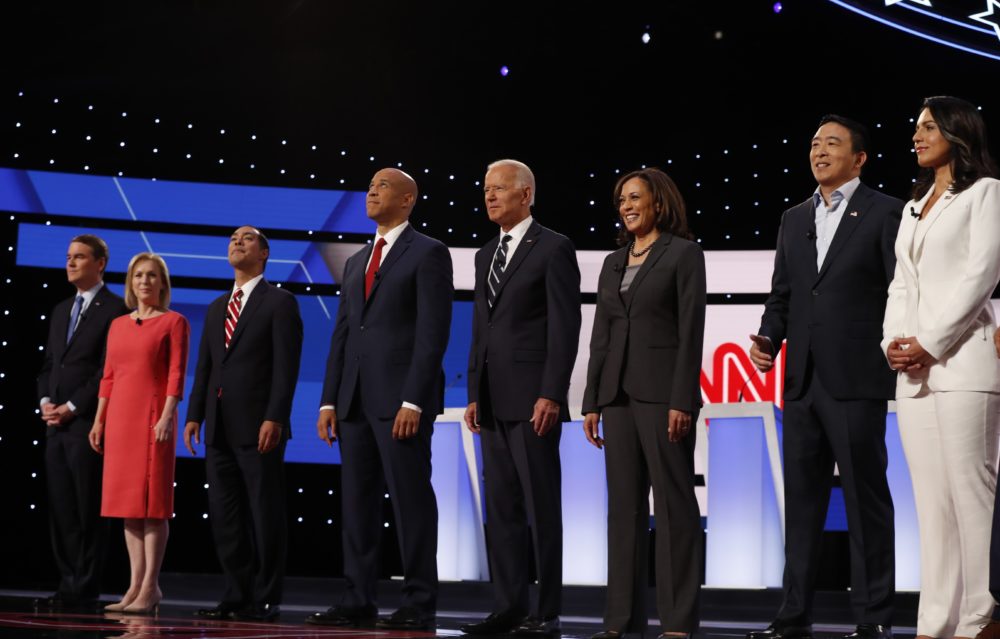 Several Democratic 2020 hopefuls stand before the audience the party's second presidential primary debate hosted by CNN on July 31 in Detroit. (Carlos Osorio/AP)