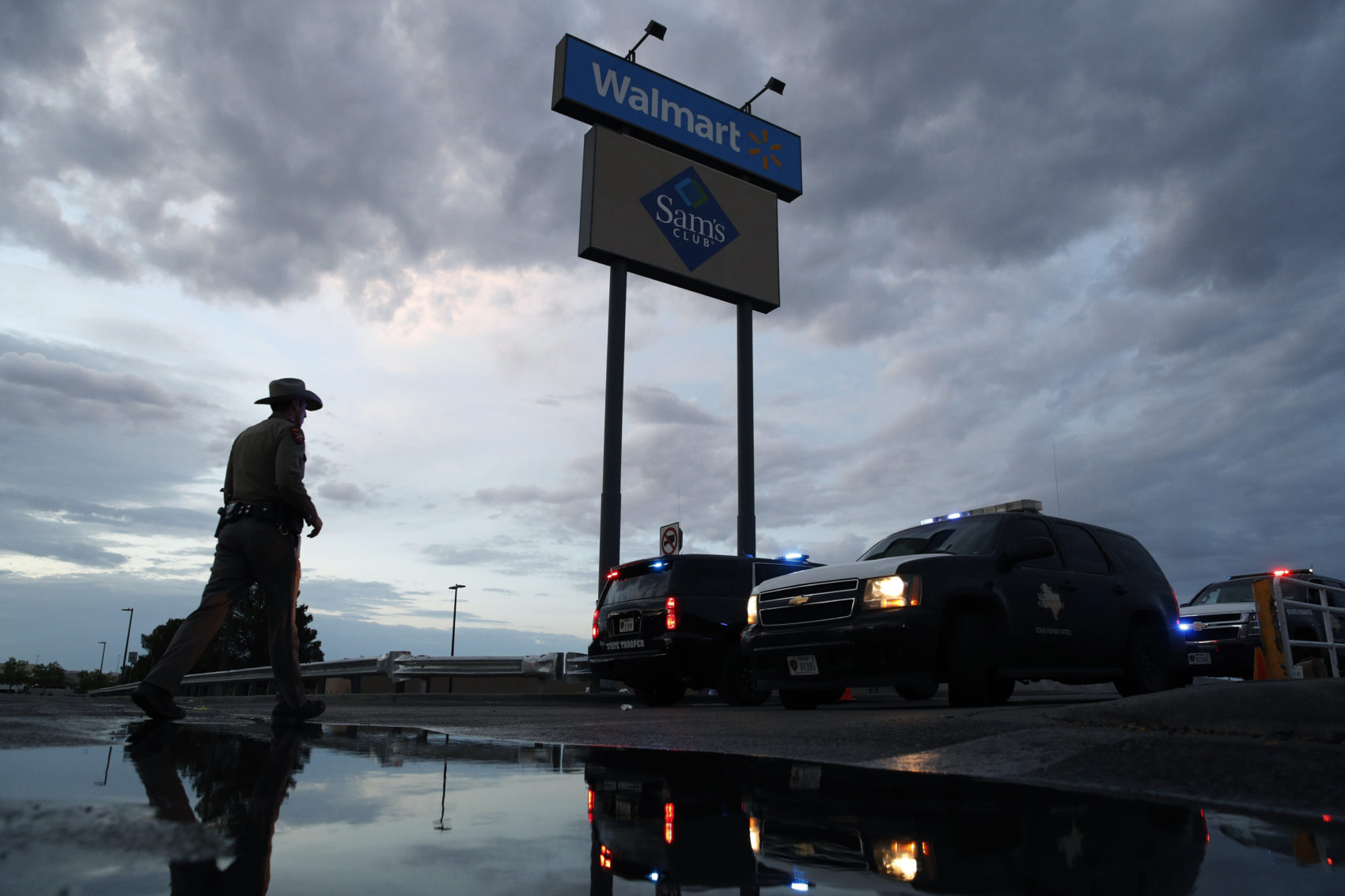 Law enforcement officials block a road at the scene of a mass shooting at a shopping complex Sunday, Aug. 4, 2019, in El Paso, Texas. (John Locher/AP)