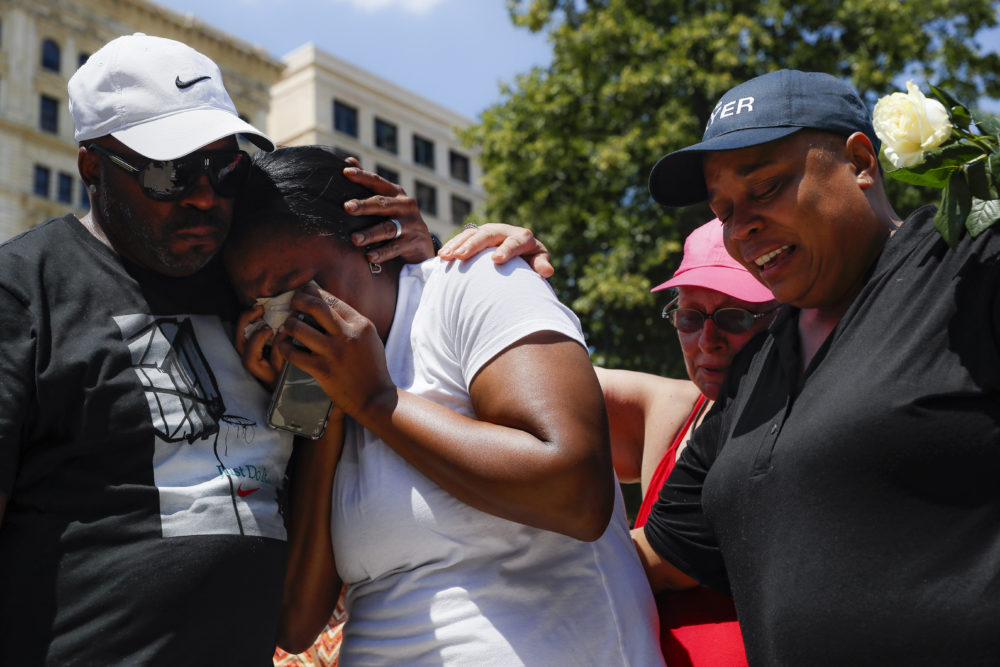 Mourners gather at a vigil following a nearby mass shooting, Sunday, Aug. 4, 2019, in Dayton, Ohio. Multiple people in Ohio have been killed in the second mass shooting in the U.S. in less than 24 hours, and the suspected shooter is also deceased, police said. (John Minchillo/AP)