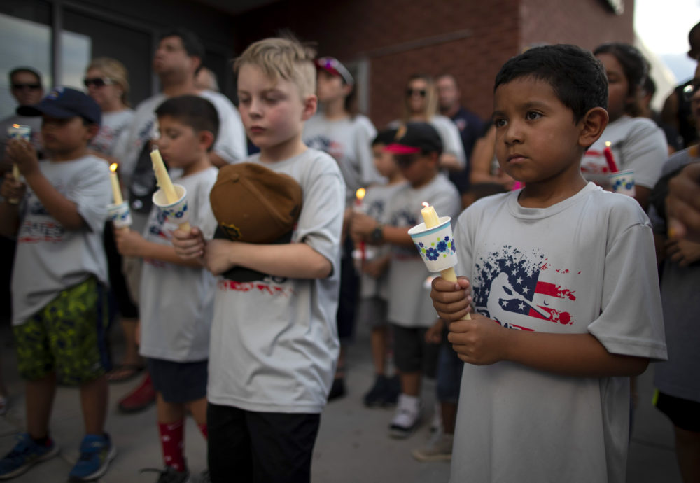 Children of a youth sports community participate in a vigil for the victims of Saturday's mass shooting in El Paso, Texas, Sunday, Aug. 4, 2019. (Andres Leighton/AP)