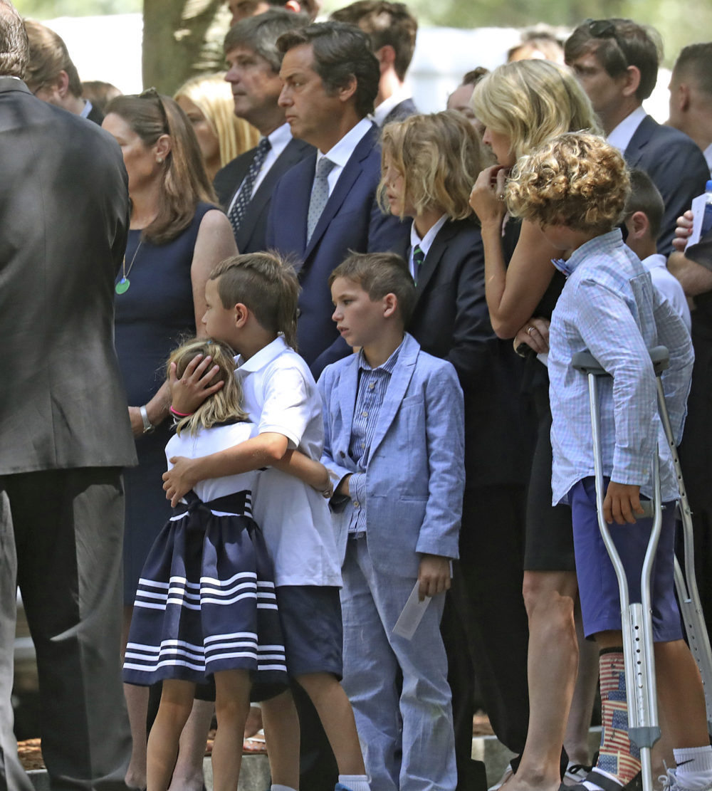Family and friends stand outside the church during funeral services for Saoirse Roisin Kennedy Hill at Our Lady of Victory Church on Monday, Aug. 5. (David L Ryan/The Boston Globe via AP, Pool)