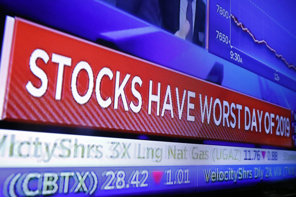 A television screen on the floor of the New York Stock Exchange headlines the day's trading, Monday, Aug. 5, 2019. (Richard Drew/AP)