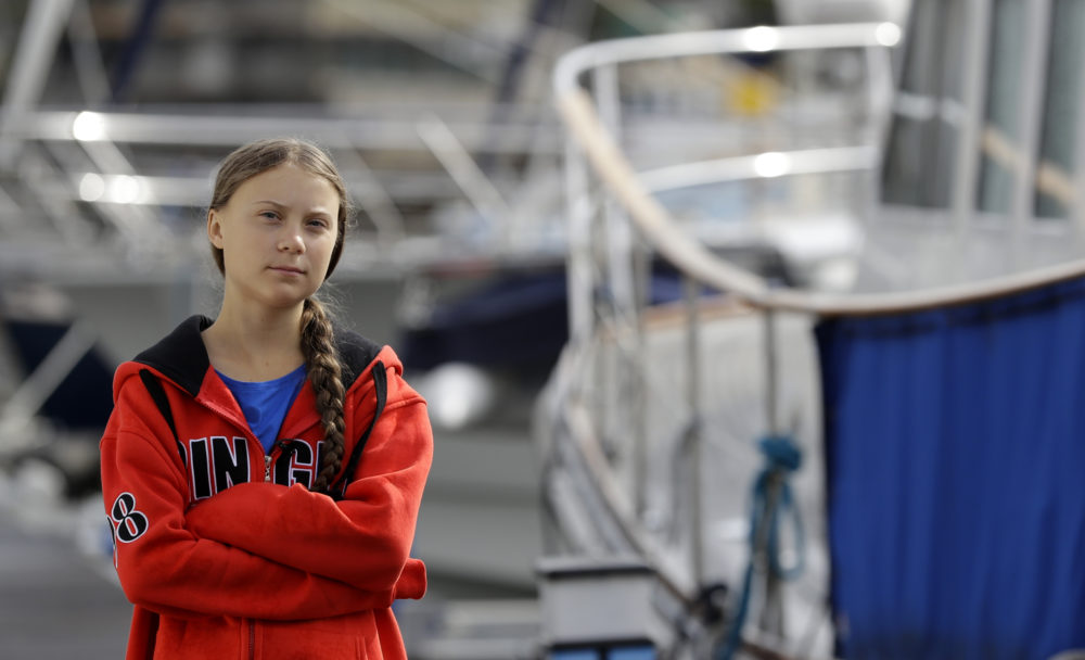 Greta Thunberg walks in the marina where the boat Malizia is moored, in Plymouth, England, on Aug. 13. The 16-year-old activist, who has inspired student protests around the world, sailed to New York in a high-tech but low-comfort boat to raise awareness for climate change. (Kirsty Wigglesworth/AP)