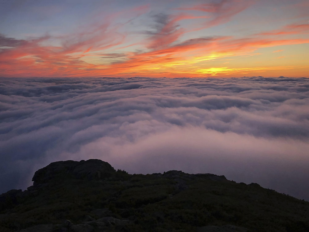 This photo taken by Philip Carcia on Aug. 30, 2018, shows the sunset from Mount Jefferson, one of 48 mountains in New Hampshire with summits higher than 4,000 feet. (Philip Carcia via AP)