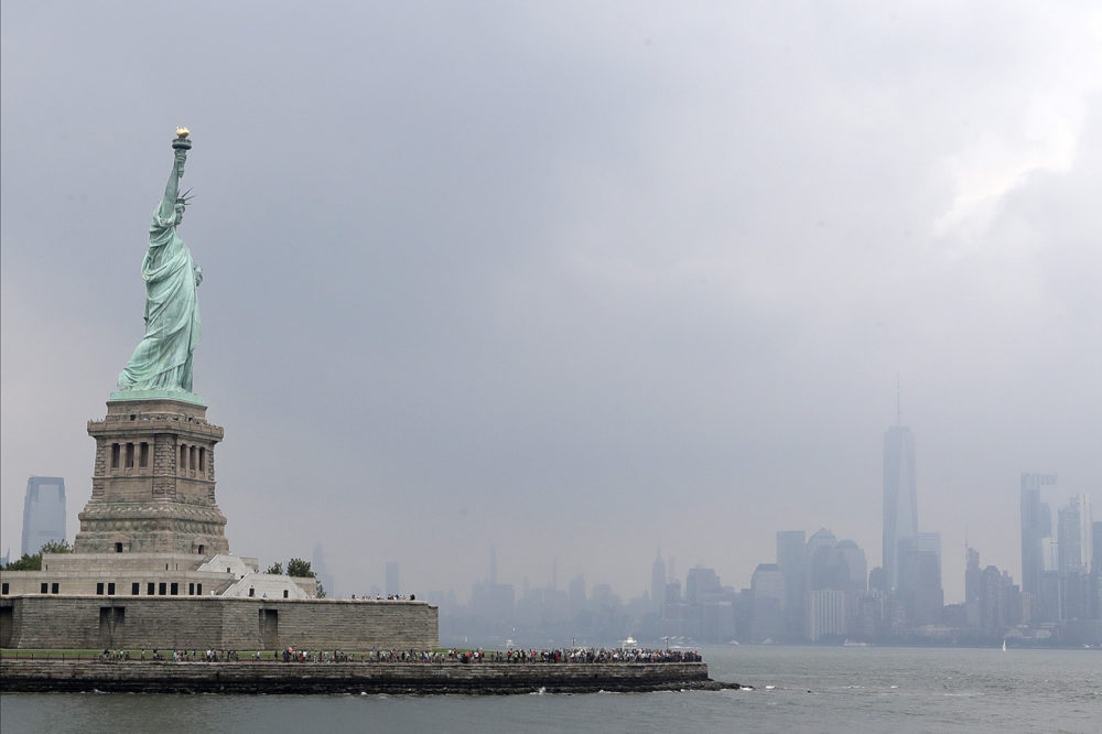 This photo shows the Statue of Liberty on a stormy afternoon in New York on Wednesday, Aug. 14, 2019. A biographer of poet Emma Lazarus on Wednesday challenged a comment by the acting director of U.S. Citizenship and Immigration Services, explaining that Lazarus' words were her way of urging Americans &quot;to embrace the poor and destitute of all places and origins.&quot; (Kathy Willens/AP)