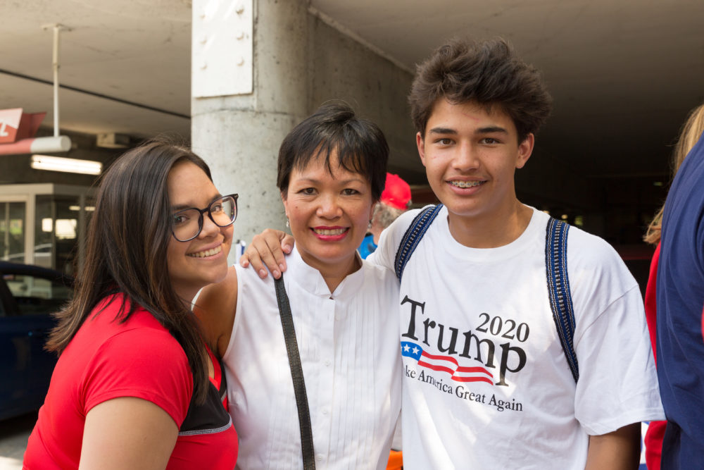 Alicia Kemp was one of a few dozen nonwhite people among the crowd of nearly 20,000 at the rally. She brought two of her six children. (Rachael Banks for Here & Now)