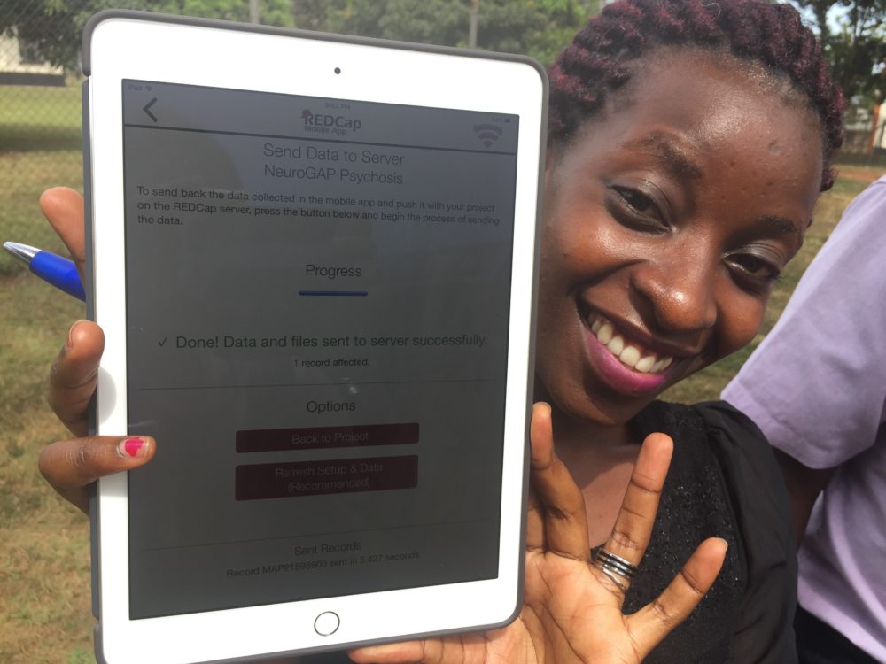 Naome Nyinomugisha uploads data from the first participant to take part in the NeuroGAP-Psychosis study in Uganda. (Courtesy Kristi Post)
