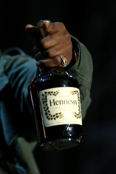 Rapper Nas holding a bottle of Hennessy. (Courtesy Christopher Polk/Getty Images for Coachella)