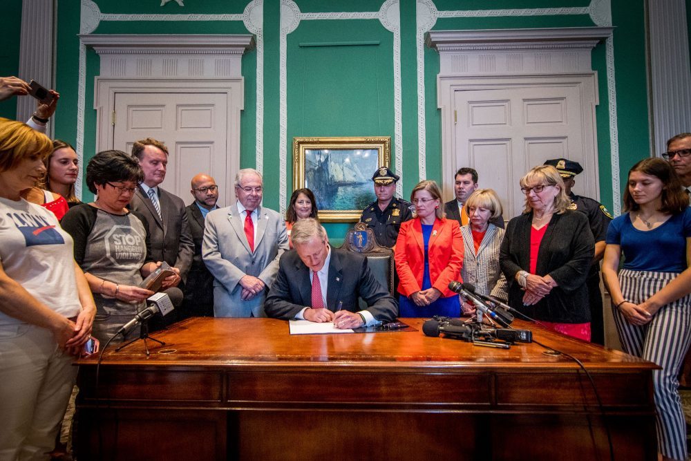 Gov. Charlie Baker signs the &quot;red flag&quot; bill into law on July 3, 2018. (Courtesy of the governor's office)