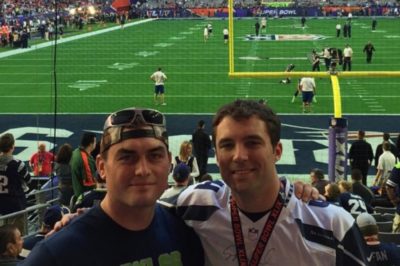 Alex Buggy (left) and Scott Secor (right) at the Super Bowl. Stephen Hauschka warms up in the background. (Courtesy Scott Secor)