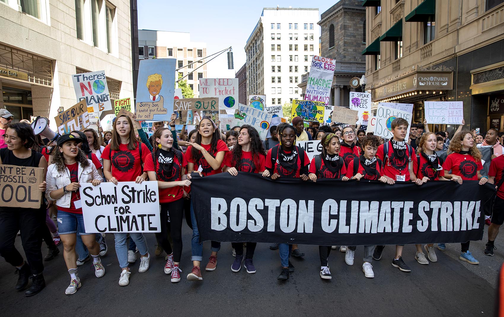 Youth climate strike protesters march through Boston toward the State House. (Robin Lubbock/WBUR)