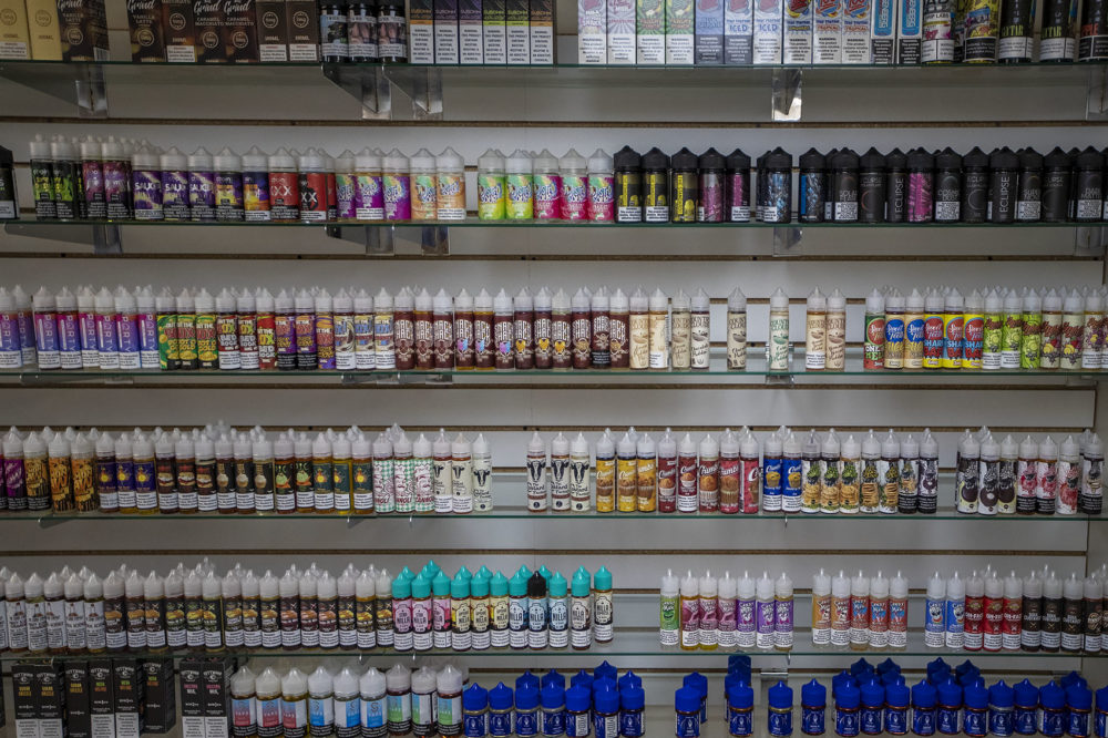 Vaping juices available at Liquid Smoke & Vape Shop in Allston, which will no longer be available after Baker's declaration of a four-month temporary ban on all vaping products. (Jesse Costa/WBUR)