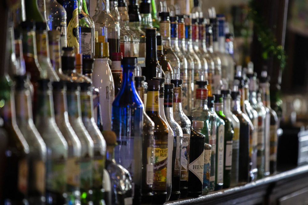 Bottles of liquor behind the bar at Doyle's Cafe in Jamaica Plain. (Jesse Costa/WBUR)