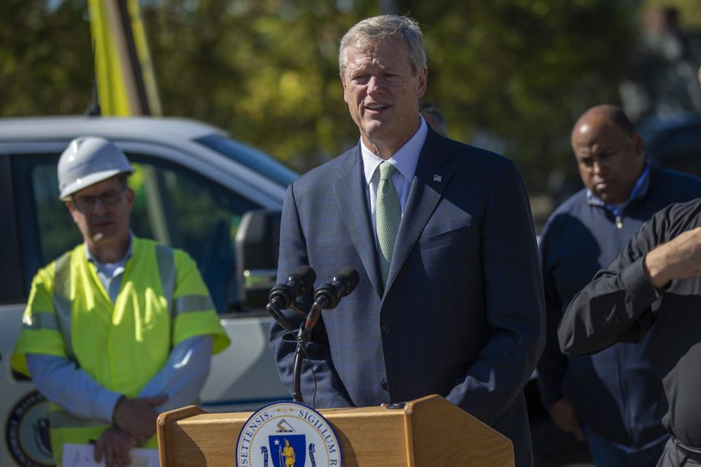 Gov. Charlie Bakes addresses the media during a press conference in Lawrence. At left is Columbia Gas of Massachusetts President Mark Kempic; at right is Lawrence Mayor Dan Rivera. (Jesse Costa/WBUR)
