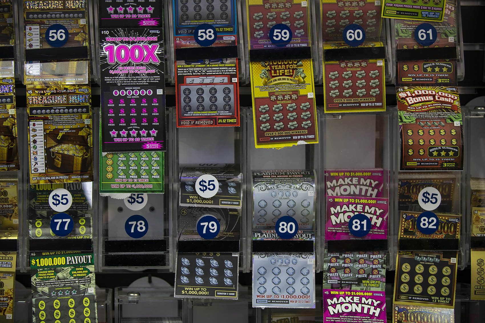 The lottery ticket display behind the counter at College Convenience on Huntington Avenue. (Jesse Costa/WBUR)