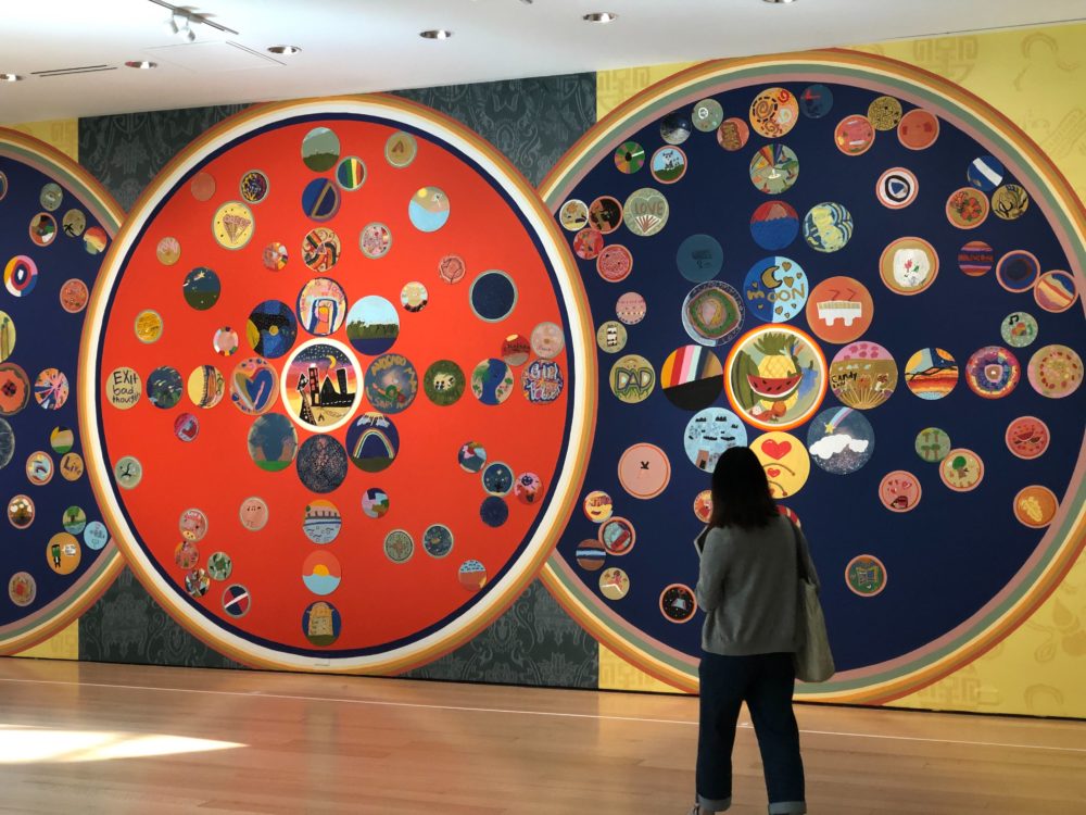 A visitor walks by &quot;Mindful Mandalas&quot; in the Linde Gallery at the MFA. (Courtesy)