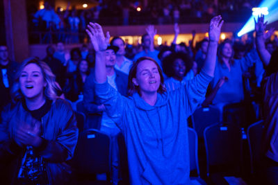 In this Oct. 22, 2017 photo, people worship during a service at Hillsong Church in New York. (AP Photo/Andres Kudacki)
