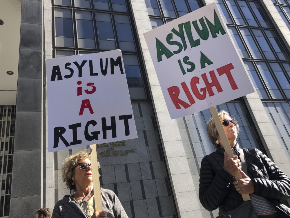 Protesters hold signs outside the San Francisco Federal Courthouse on Wednesday, July 24, 2019 in San Francisco, Calif. (Haven Daley/AP)
