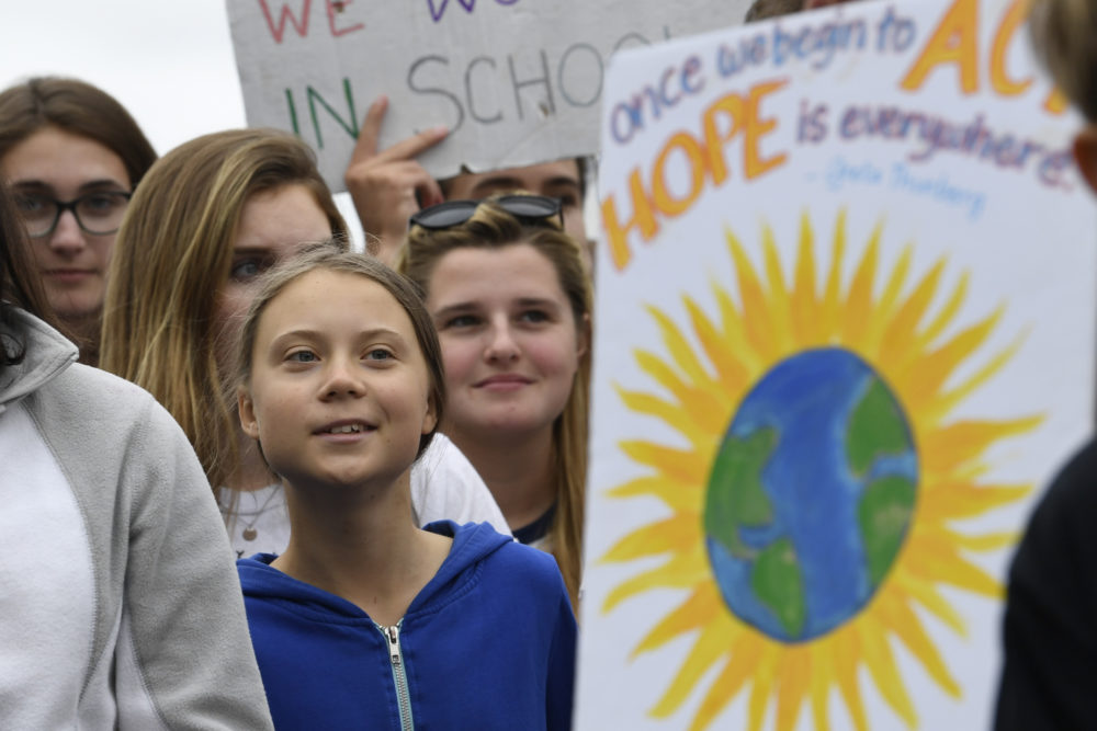 Swedish youth climate activist Greta Thunberg, center in blue, joins other young climate activists Friday for a climate strike outside the White House in Washington, Friday, Sept. 13, 2019. (Susan Walsh/AP)