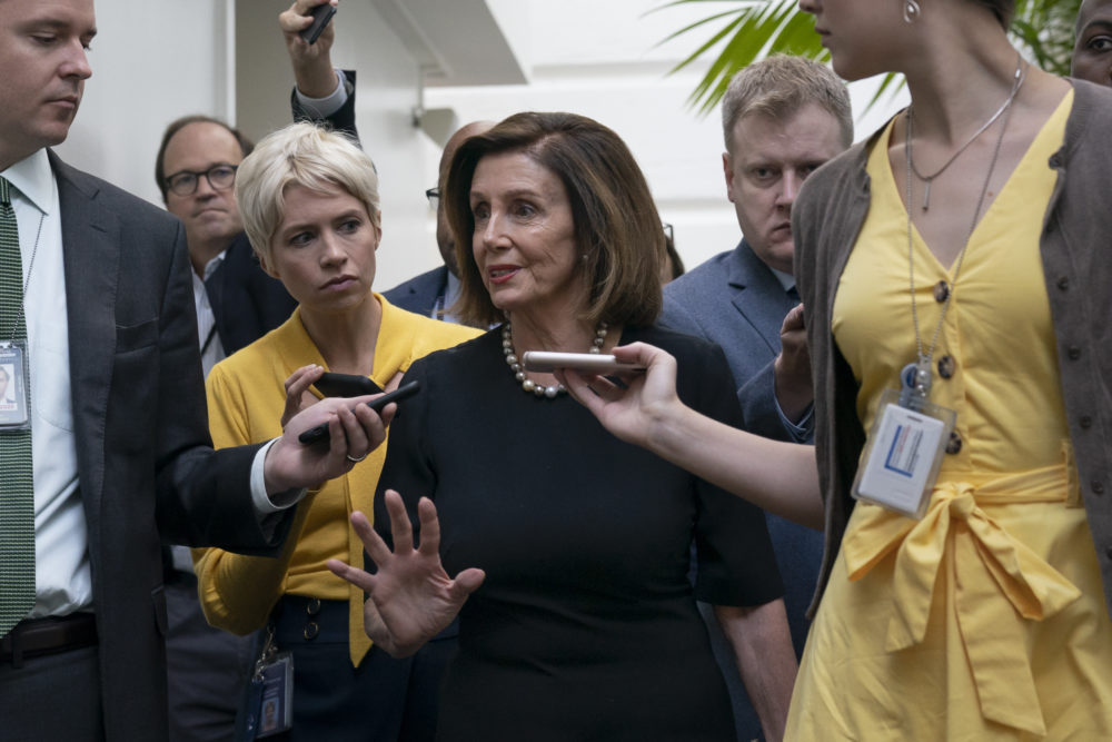 Speaker of the House Nancy Pelosi, D-Calif., is surrounded by reporters as she arrives to meet with her caucus the morning after declaring she will launch a formal impeachment inquiry against President Donald Trump, at the Capitol in Washington, Wednesday, Sept. 25, 2019. (J. Scott Applewhite/AP)