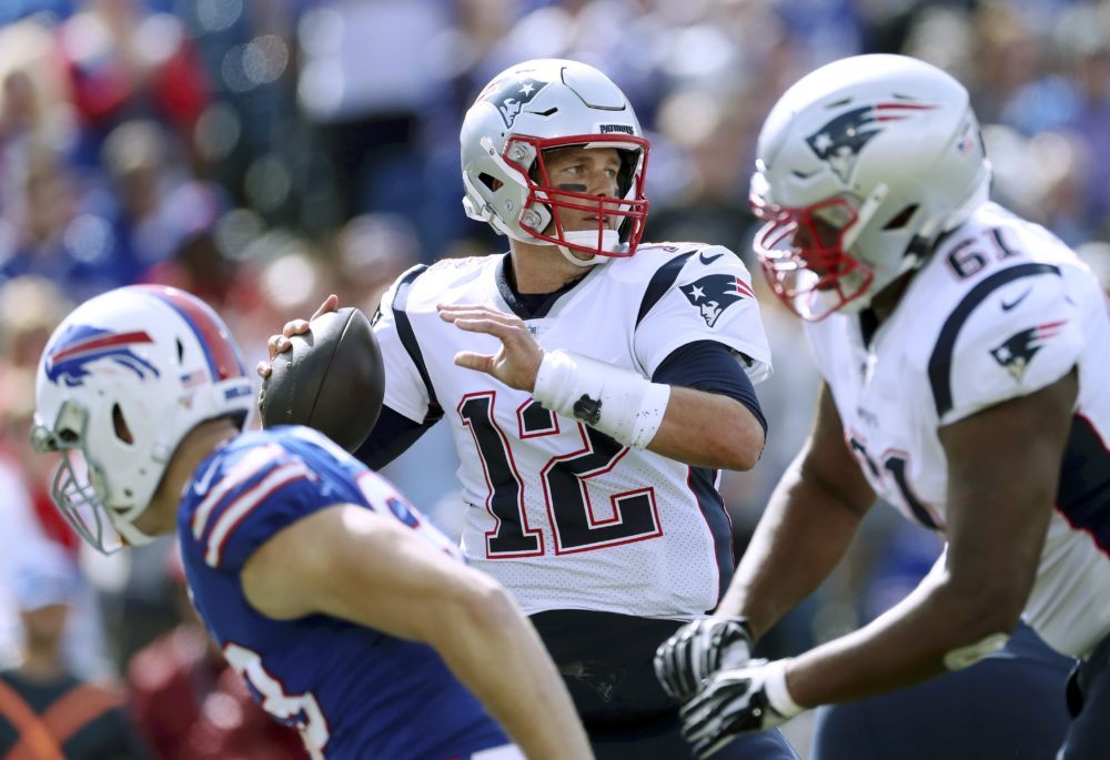 New England Patriots quarterback Tom Brady passes against the Buffalo Bills in the first half of the game. (Ron Schwane/AP)