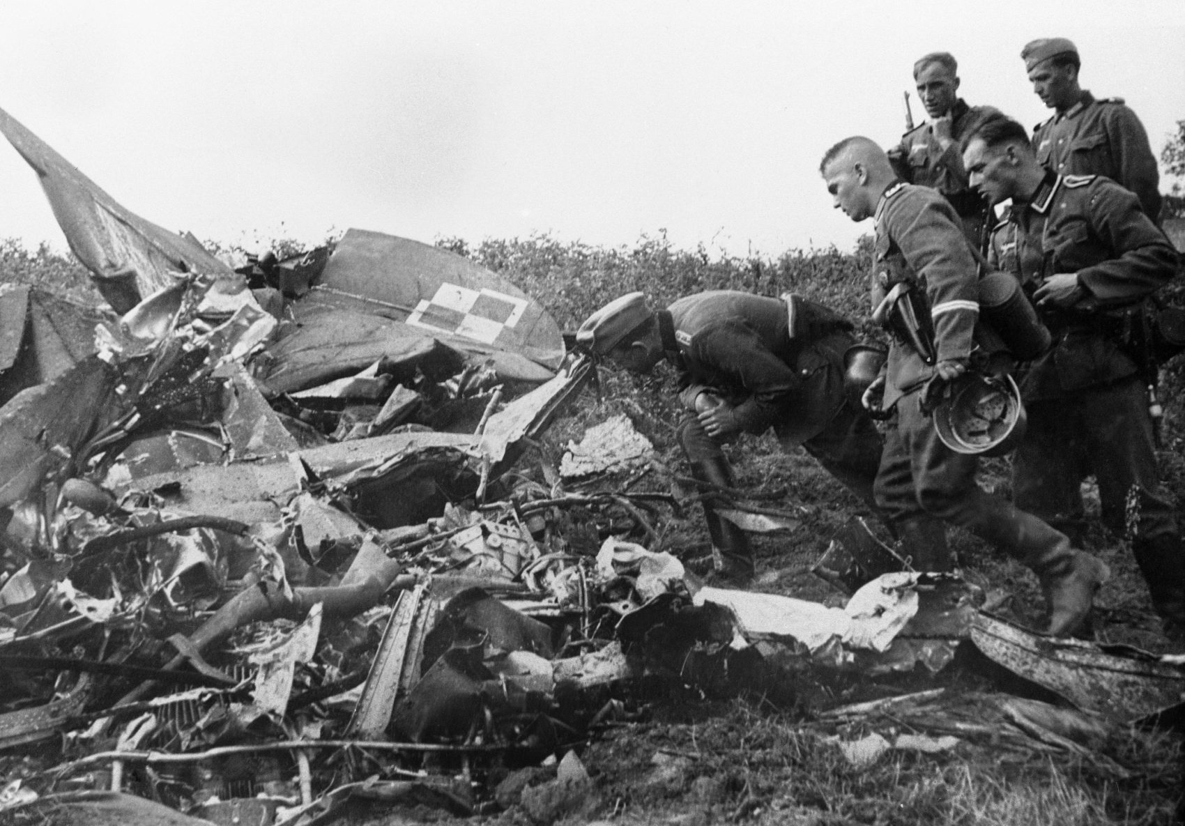 German soldiers inspect the wreckage of a Polish army plane shot down by a German pilot during an air raid, Sept. 8, 1939. (AP file photo)