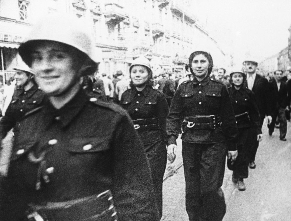 Steel-helmeted, uniformed Polish women march through the streets of Warsaw to aid in defense of their capital after German troops had started their invasion of Poland, Sept. 16, 1939. (AP file photo)