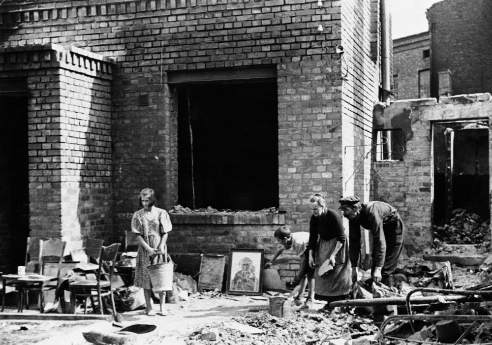 When the guns and bombardment quieted, Warsaw families like this one crept from their shelters and poked through ruins of their homes to see what could be salvaged on Oct. 7, 1939. (Julien Bryan/AP)