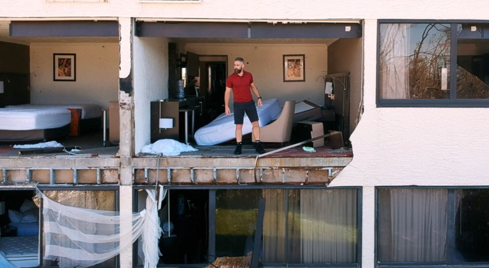 Josh Morgerman in a hotel damaged by a hurricane. (Photo courtesy of Discovery)