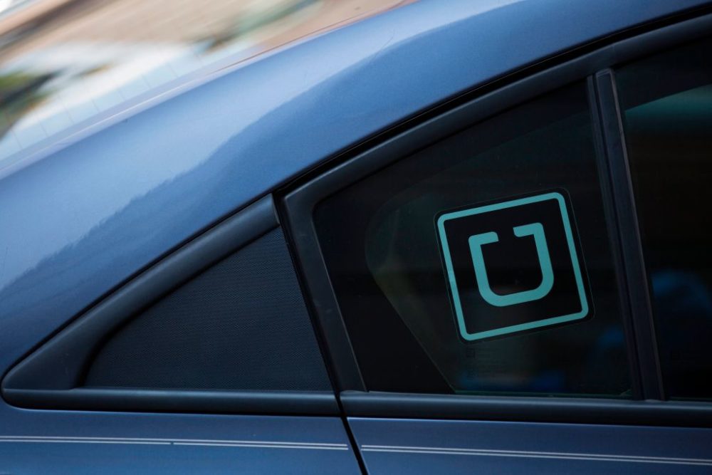 The Uber logo is seen on a car in Washington, DC, on July 9, 2019. (Alastair Pike/AFP/Getty Images)