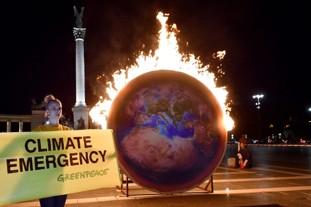 The Earth on fire is seen during a Greenpeace protest at the Heroes square in Budapest on Sept. 4, 2019. (Attila Kisbenedek/AFP/Getty Images)