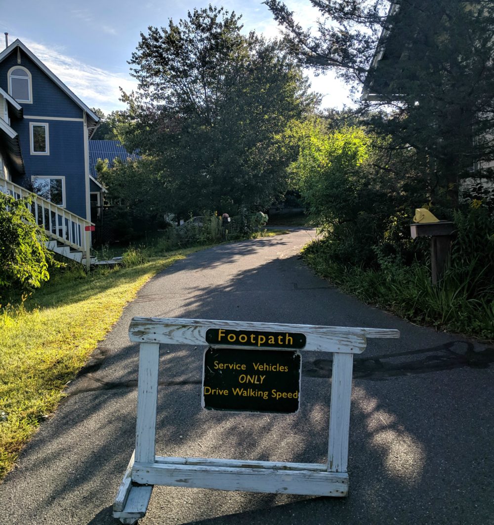 This paved path winds through the author's cohousing community. Members park their cars on the outside of the property, allowing for a mostly car-free space. (Courtesy)