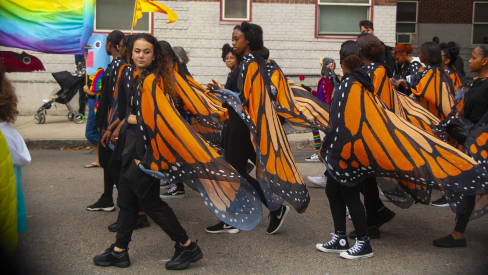 Boston Arts Academy students participate in the Joy Parade as a butterfly migration. (OJ Slaughter for WBUR)