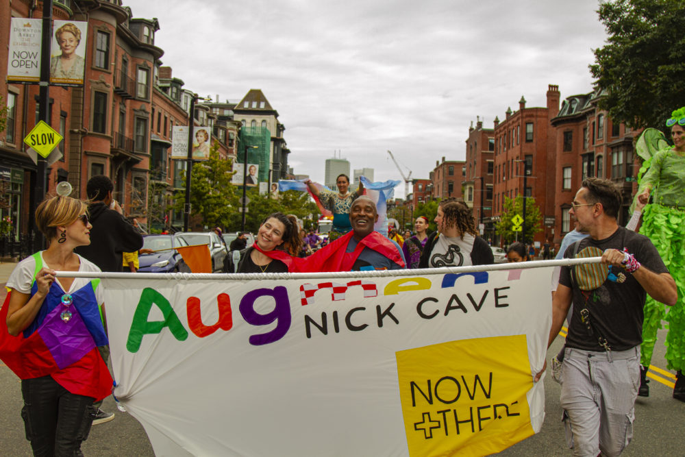 Nick Cave leads the parade through the South End. (OJ Slaughter for WBUR)