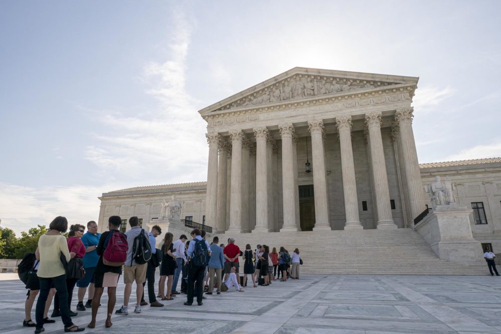 Visitors line up at the Supreme Court in Washington as the justices prepare to hand down decisions, Monday, June 17, 2019. (AP Photo/J. Scott Applewhite)