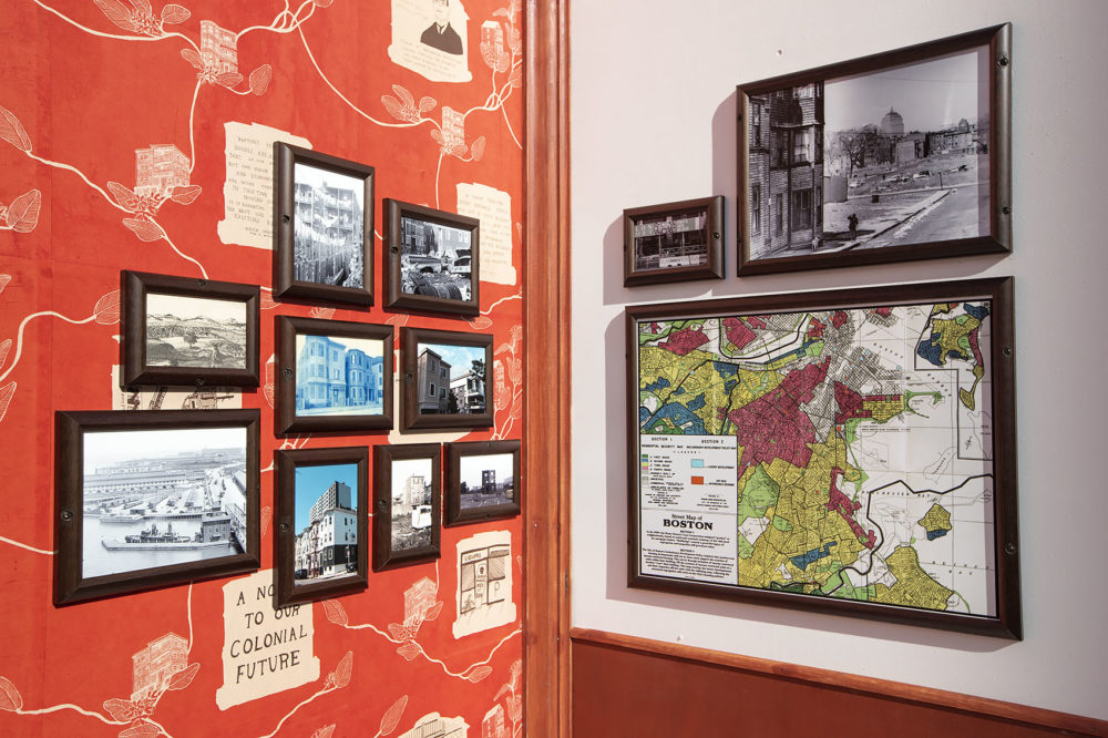 The installation features a collection of archival and contemporary images, handmade wallpaper, and an updated redlining map reflecting the city’s Inclusionary Development Policy. (Jesse Costa/WBUR)