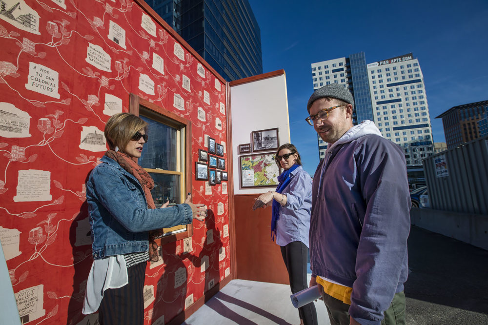 Now + There's Kate Gilbert and Leah Triplett Harrington talk with artist Pat Falco at his public art installation, &quot;MOCK.&quot; (Jesse Costa/WBUR)