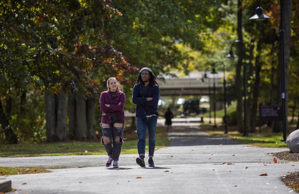 Students walk across Hampshire College's leafy campus. (Robin Lubbock/WBUR)