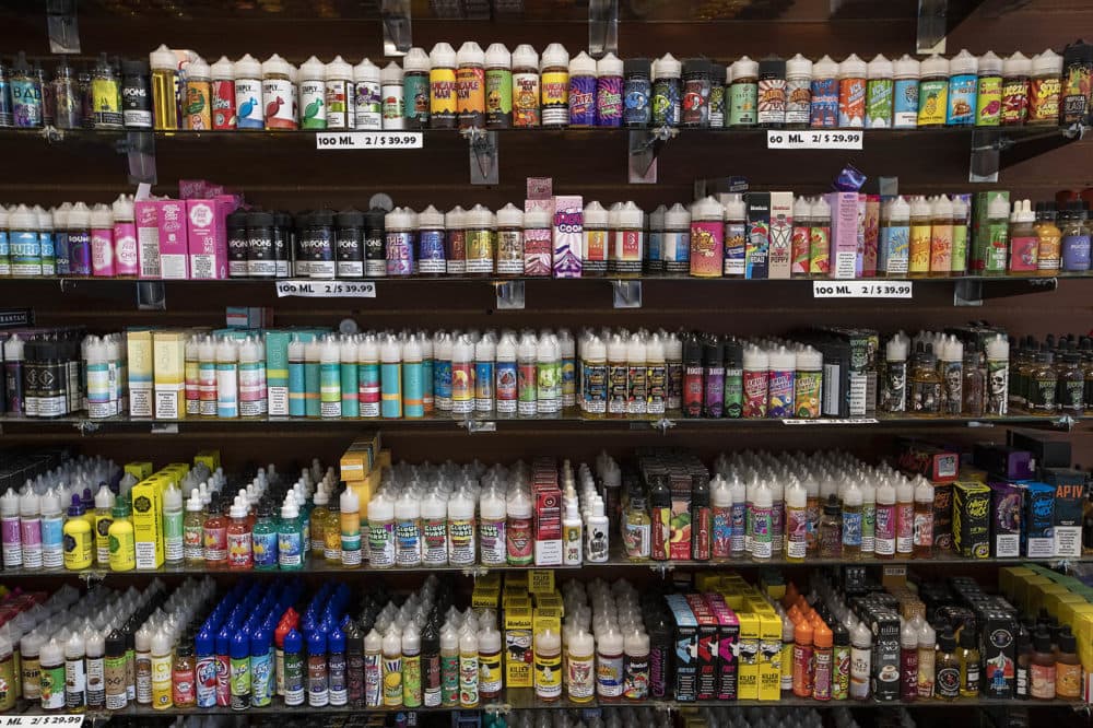 Shelves of vaping juices along a wall at Smoker Choice in Salem, N.H. (Jesse Costa/WBUR)