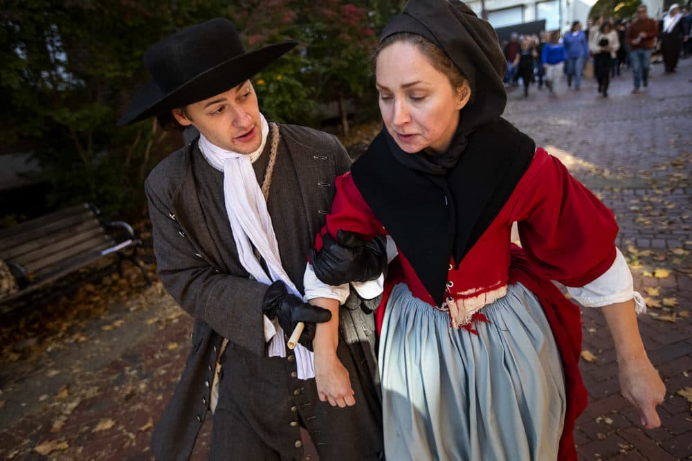 Tourists follow performers to the Old Town Hall in Derby Square for the reenactment of the witchcraft trial of Bridget Bishop, first person to be hanged in the Salem witch trials of 1692. (Jesse Costa/WBUR)