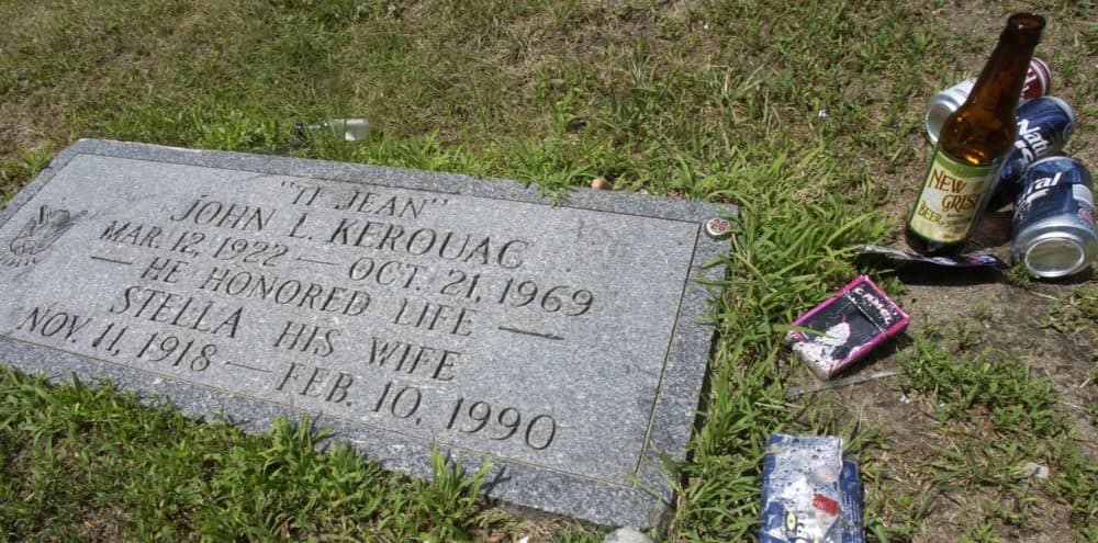 A beer bottle, cans and other items were left beside the grave of author Jack Kerouac, July 7, 2007 at the Edson Cemetery in Lowell, Mass. (Lisa Poole/AP)