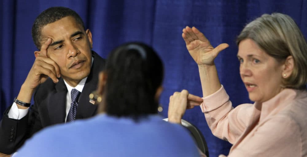 In this 2008 file photo, then-Democratic presidential candidate Barack Obama listens to then-Harvard law professor Elizabeth Warren during a discussion about predatory lending at the Illinois Institute of Technology in Chicago. (Alex Brandon/AP)