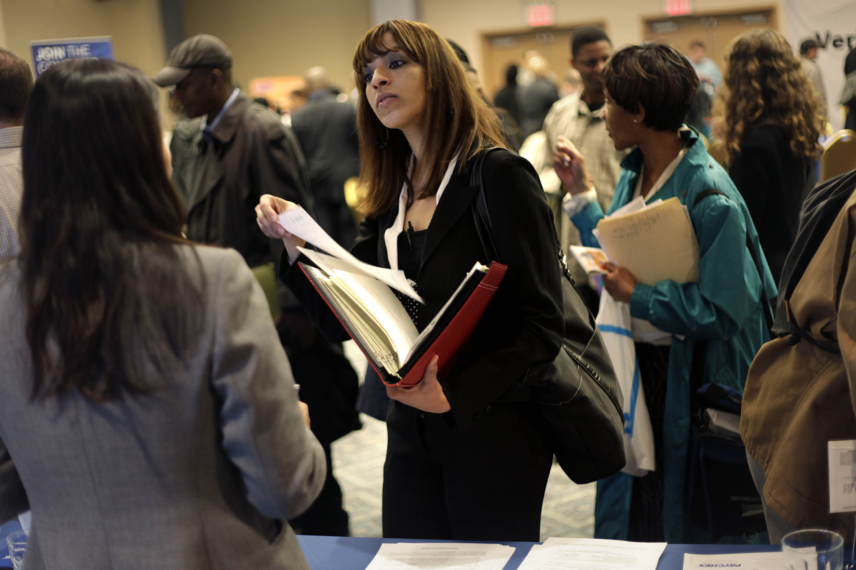 A woman at a job fair in New York talks to an employer. (Seth Wenig, File/AP)