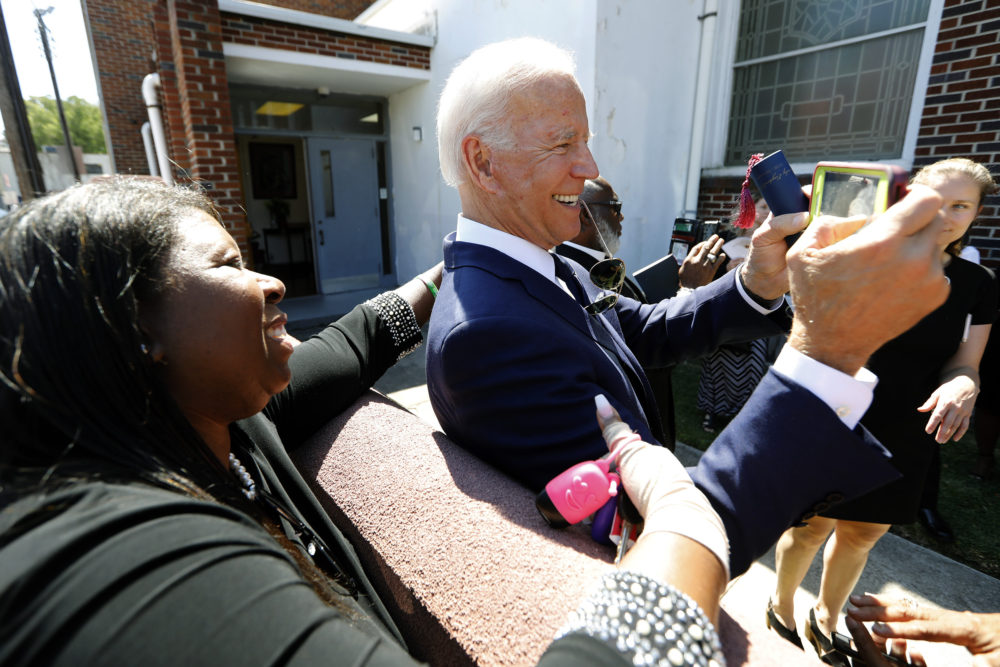 Democratic presidential candidate and former Vice President Joe Biden takes selfies with supporters after the funeral for Majority Whip Jim Clyburn's wife, Emily Clyburn, on Sept. 23 in Charleston, S.C. (Mic Smith/AP)