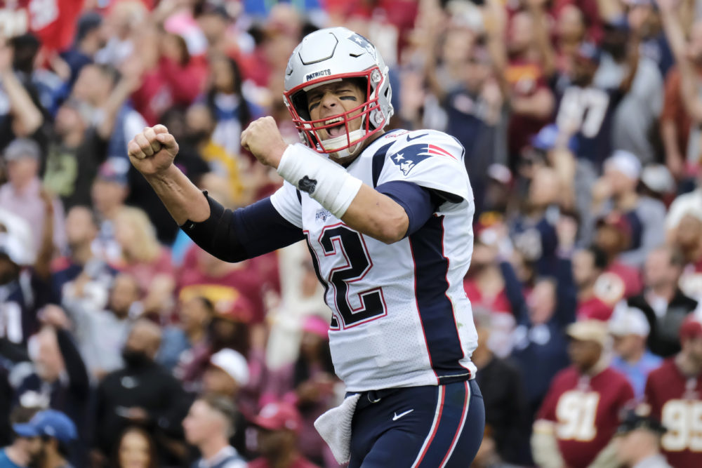 New England Patriots quarterback Tom Brady (12) reacts to a touchdown against the Washington Redskins during the second half of an NFL football game, Sunday, Oct. 6, 2019, in Washington. (AP Photo/Mark Tenally)